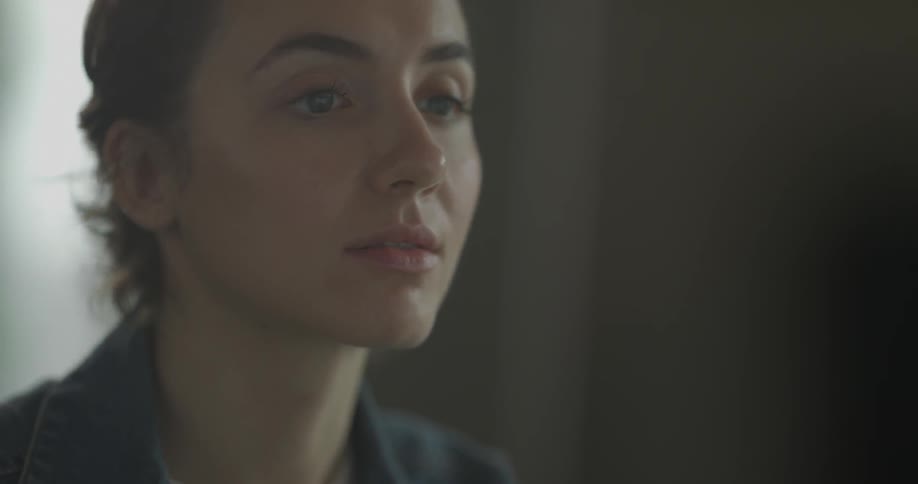 A woman is looking  around