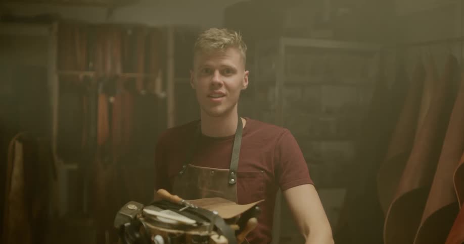 Man shapes leather strap