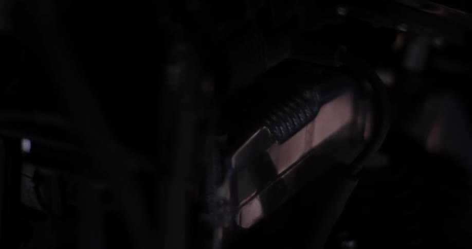 Machinery shown in very dim light