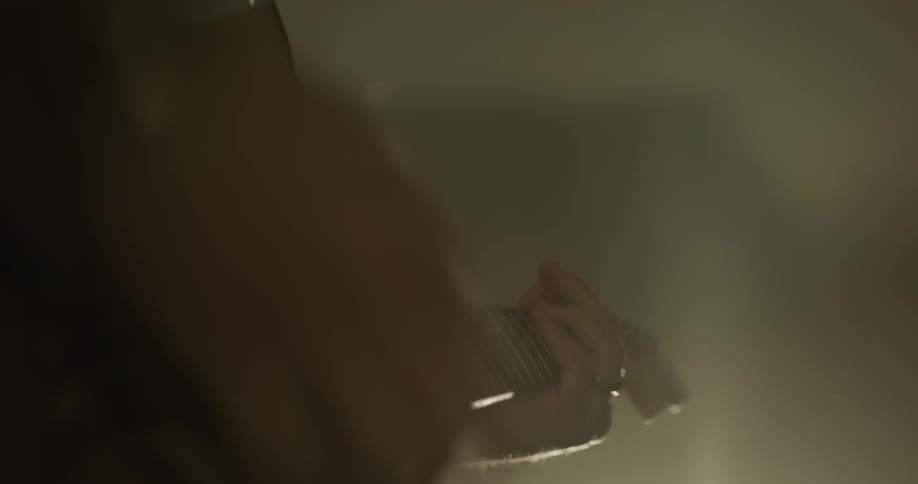 Someone plays an electric guitar