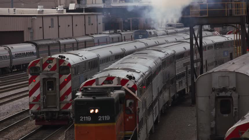 Trains pulling into a station