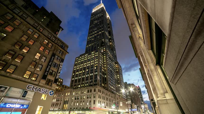 Fast motion of city building with clouds in background