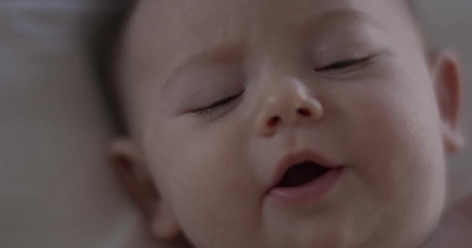 A baby is laying down