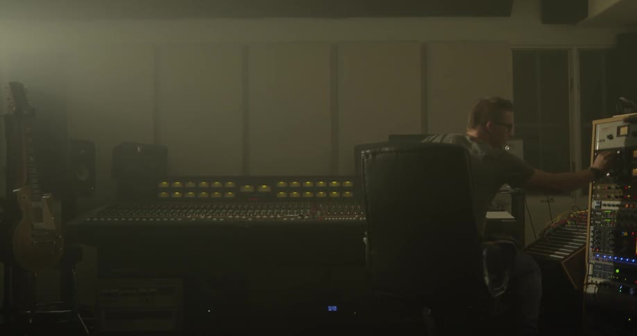 Young man operating a sound board