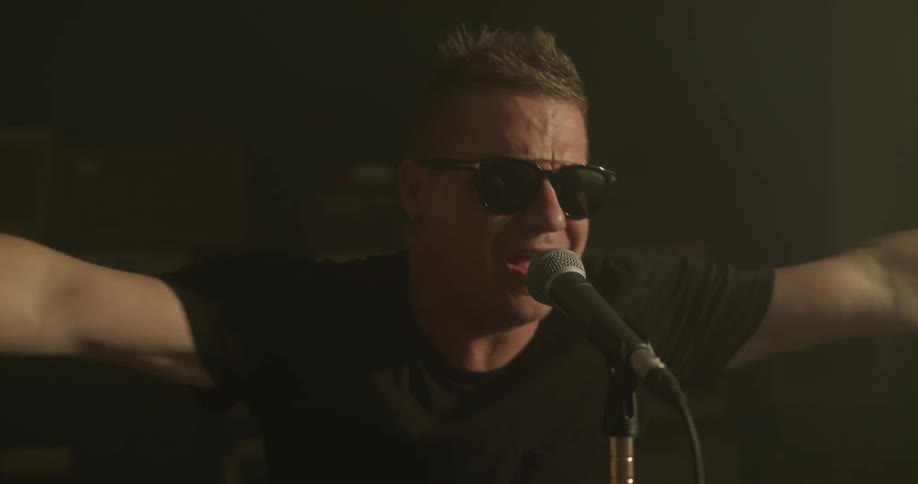 A man singing into a microphone