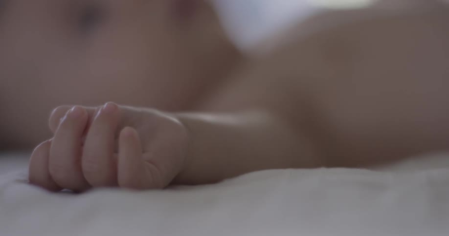 A baby is laying down