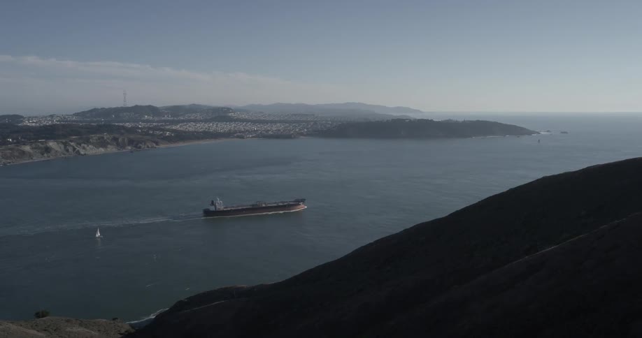 A large container ship sailing on a lake