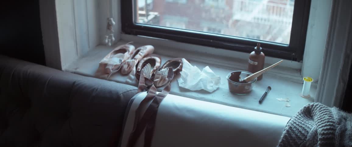Ballet shoes on a window sill