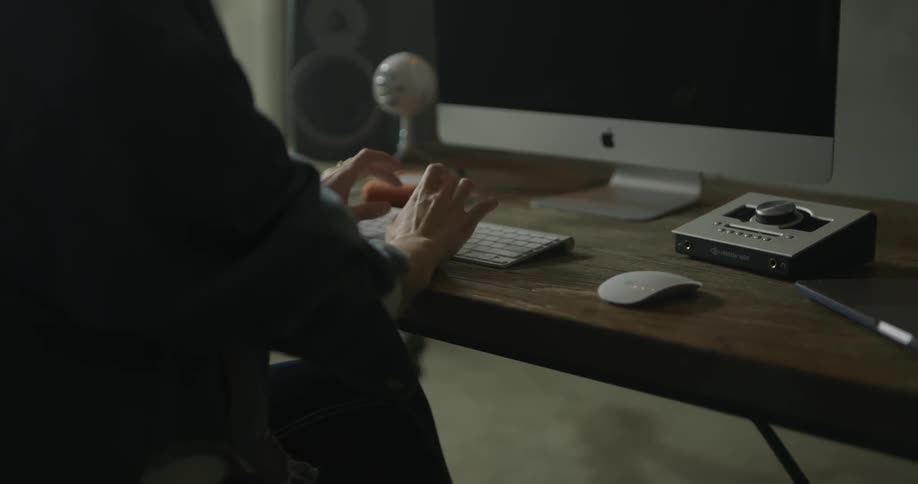 Woman Working On Computer In Studio