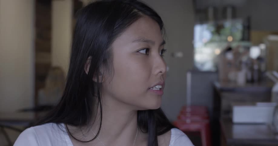 A woman talks to someone about something