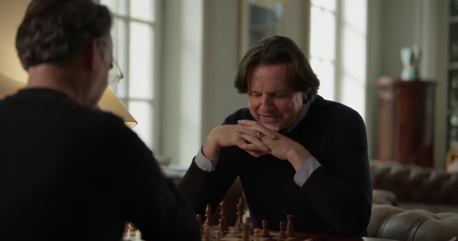 Two men playing chess with each other