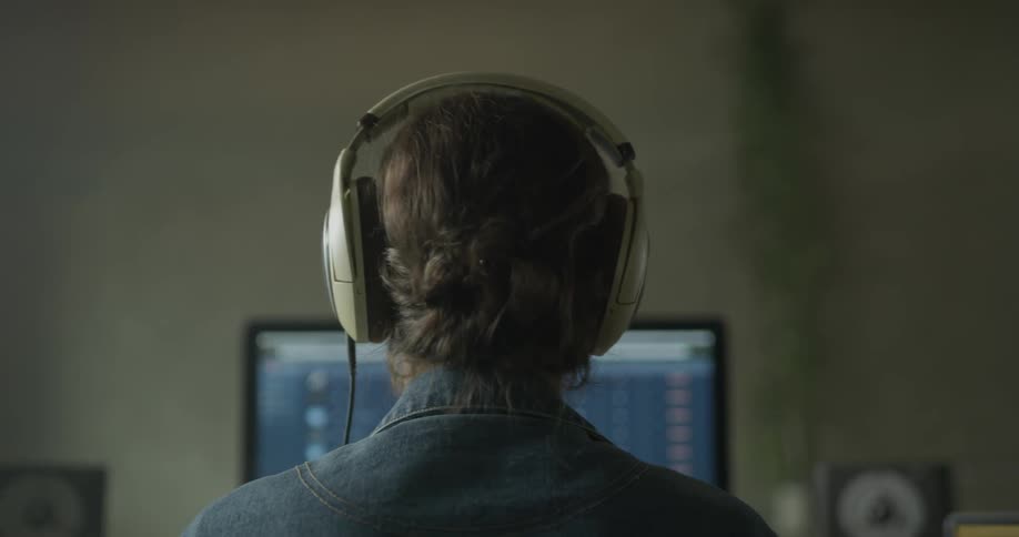 Woman Working On Computer In Studio