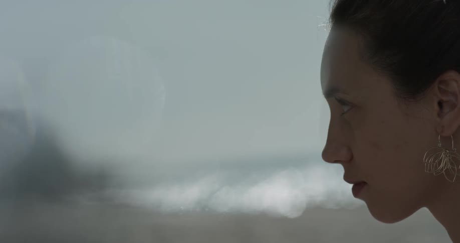 Profile view of woman looking straight ahead