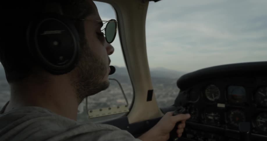 Tight shot of man flying small plane