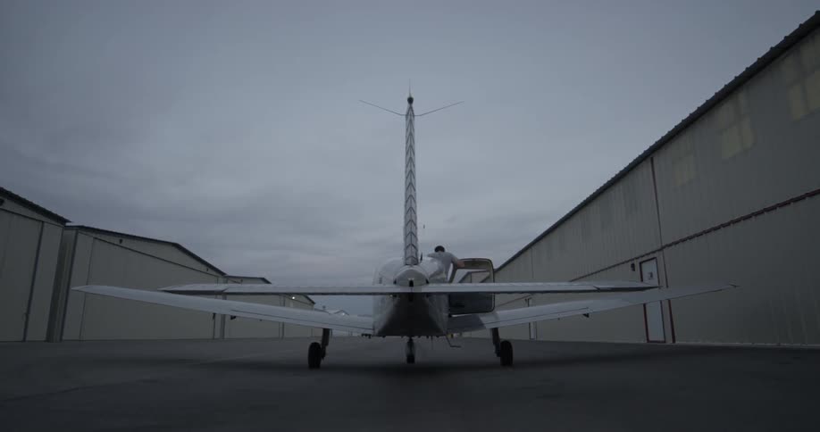 A man is getting into a airplane