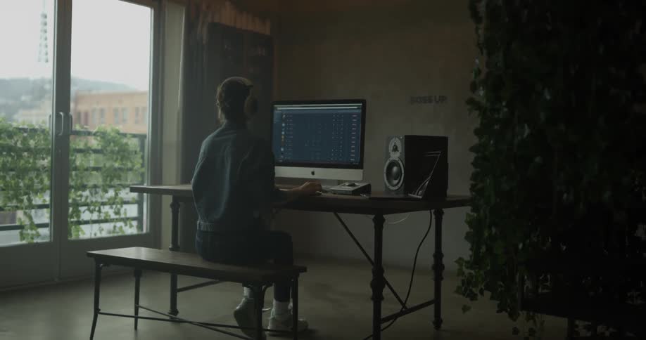 Woman Working On Computer In Studio