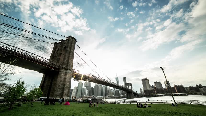 Clouds roll over a bridge and river