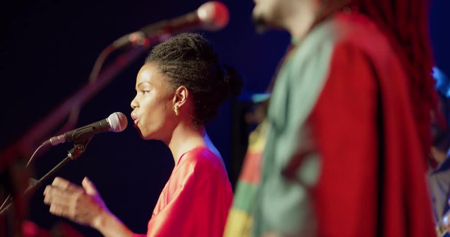 A woman and man are singing together
