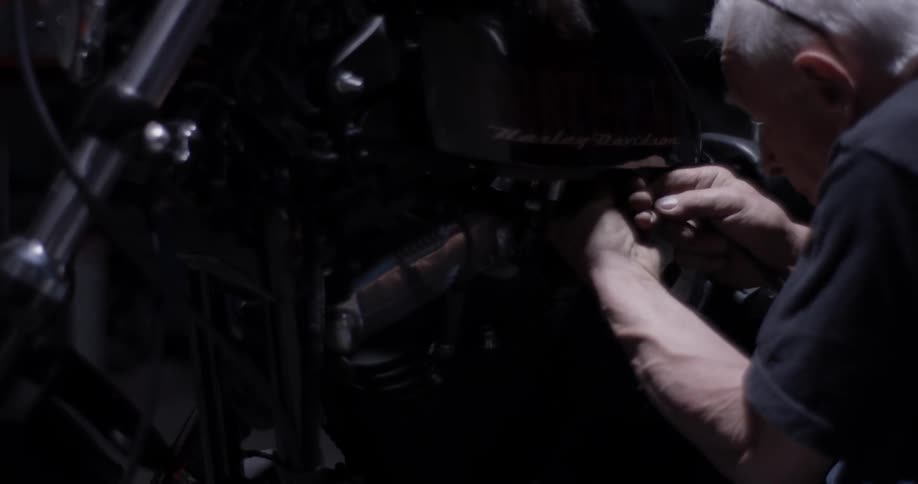 Man works on a motorcycle