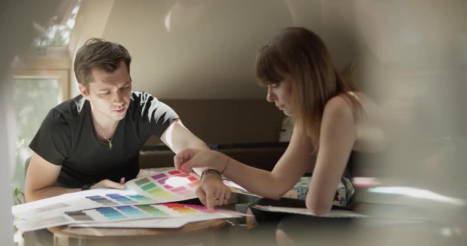 A couple look over color samples