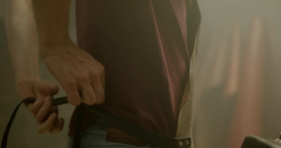 Person puts on an apron and ties it