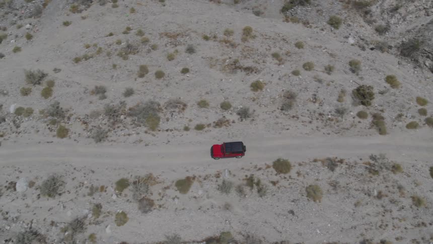 A car is driving in a remote area