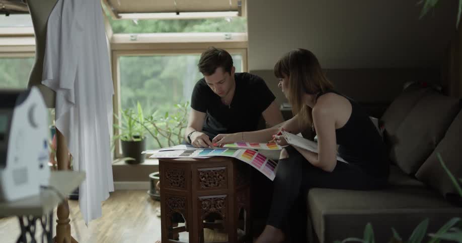 Couple look over colors while seated together