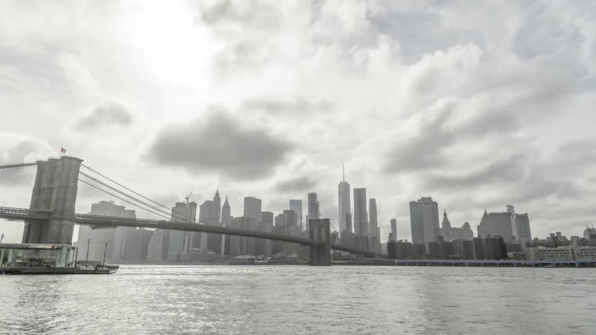Time lapse motion of boats going underneath a bridge