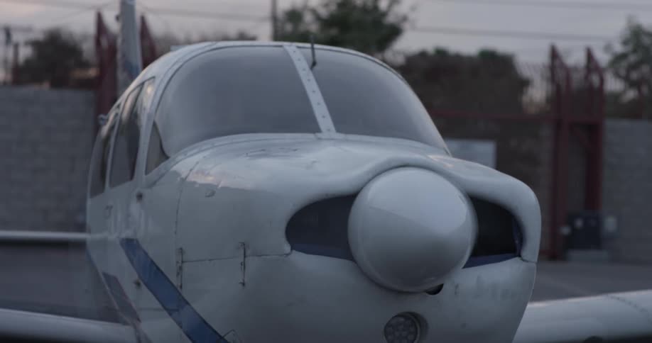A plane starts its engine and it's propeller starts to rotate rapidly