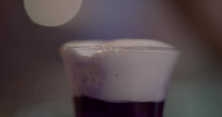 Cream being poured into a glass