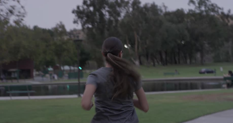 Woman jogging on a path in a park