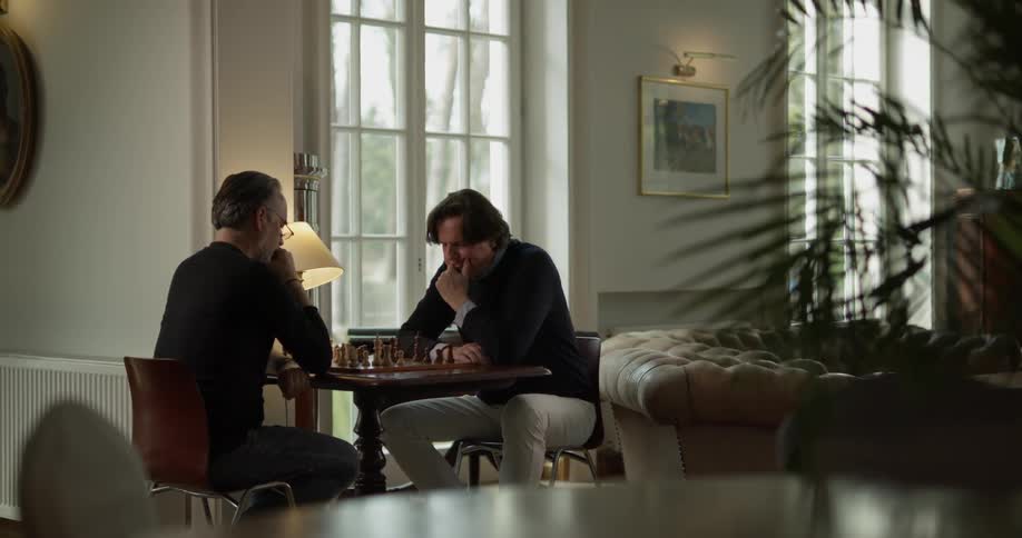 Two men play chess