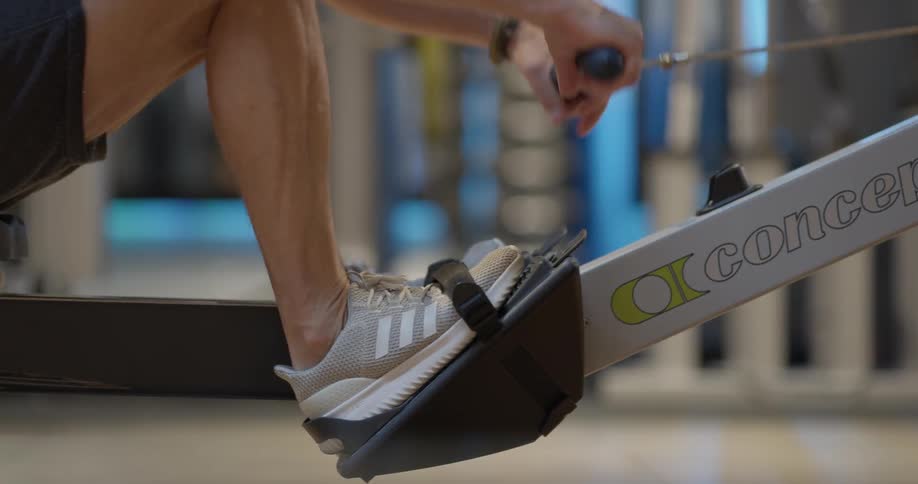 A person is using an exercising machine