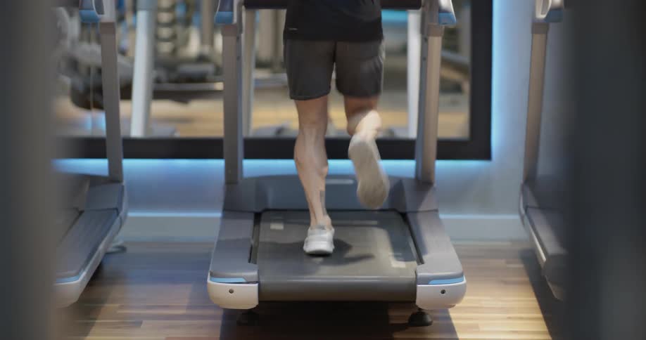 A person jogs on a treadmill