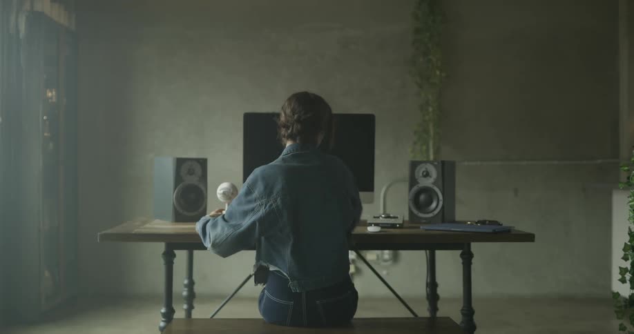 Woman Working On Computer In Studio