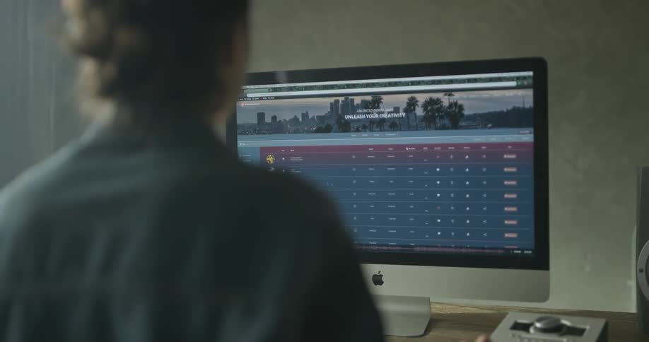 Woman Working On Computer In Studio