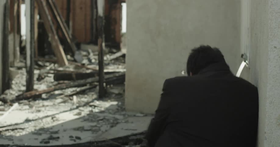 A person sitting down hard