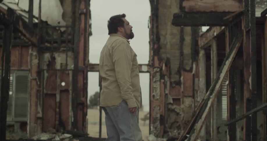 A person in a destroyed building