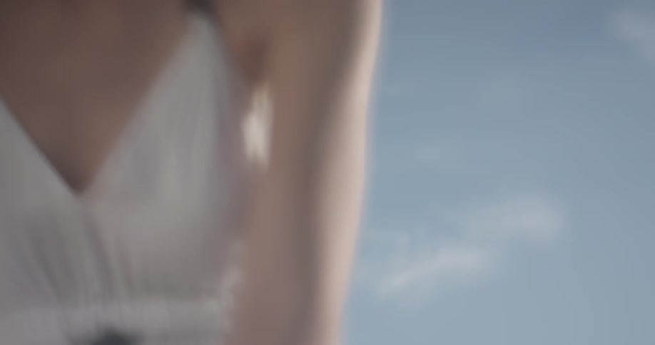 Woman sitting out on the beach in a bikini
