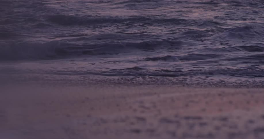 Waves wash over a beach