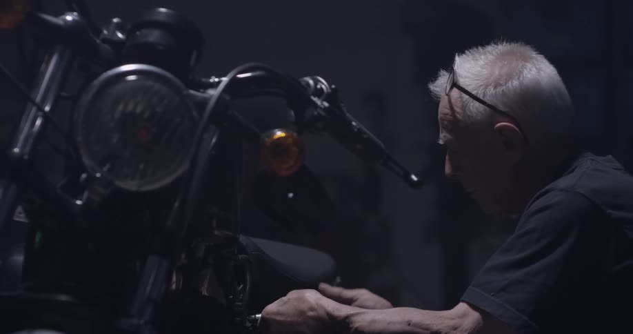 A man works on a motorcycle