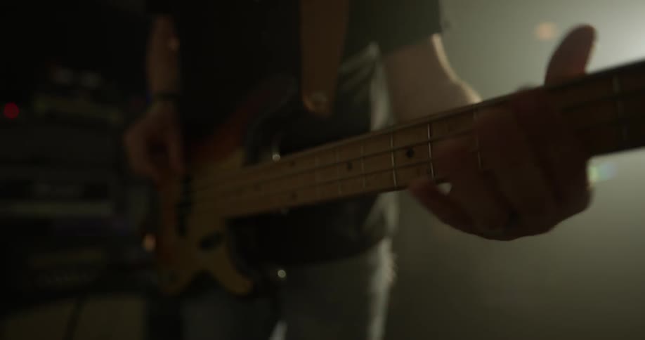 Man plays electric guitar fast