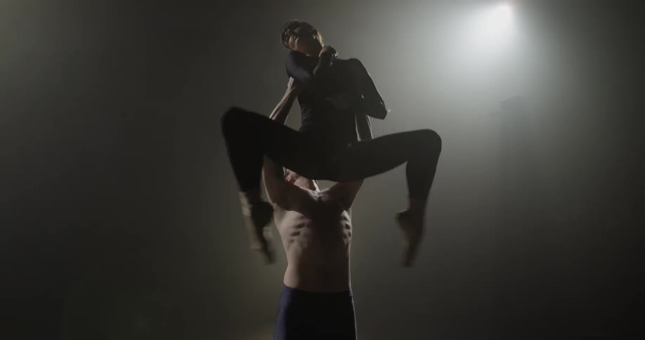Man and woman perform a dance on stage