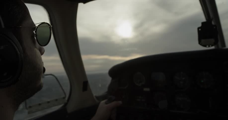 A man pilots a small plane