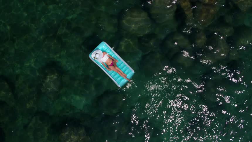 A woman floating on a raft