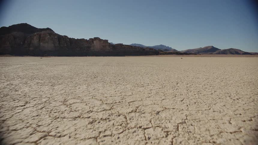 Dry and cracked flat desert land