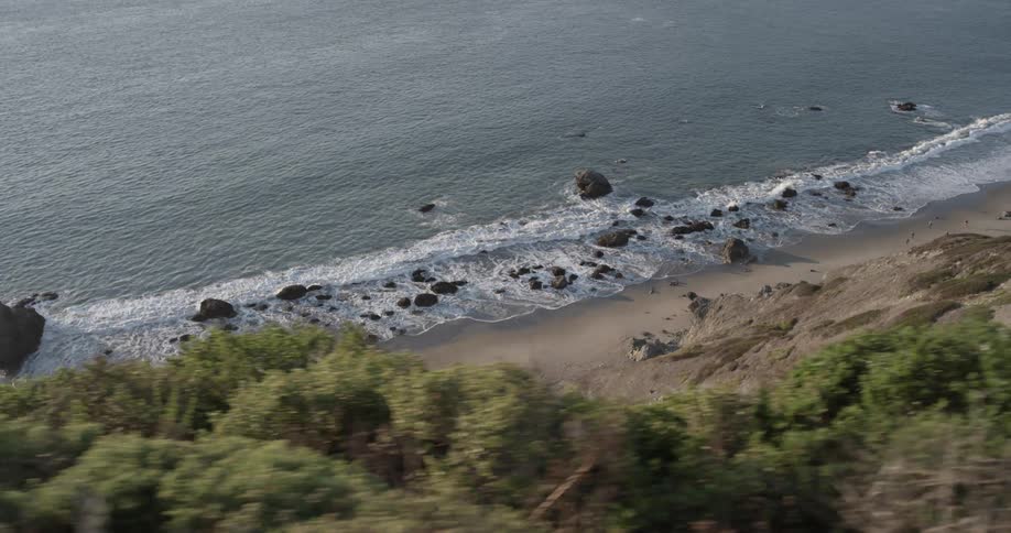 The tide flows onto the beach shore