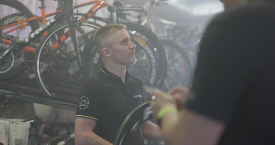 Two men work in a bike store