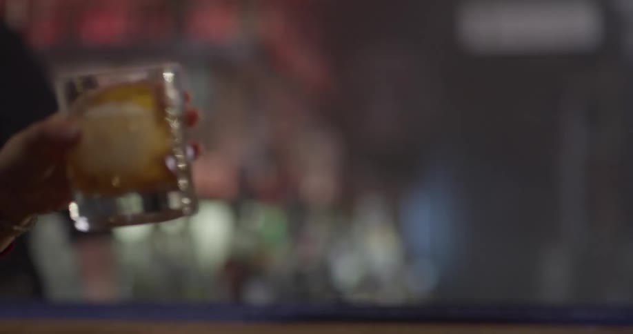 Two people are drinking at a bar