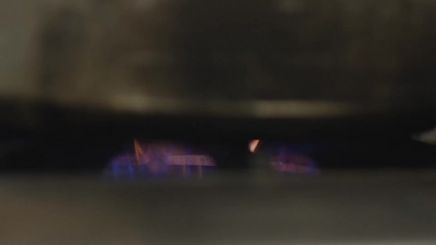 Gas stove flame under a pot